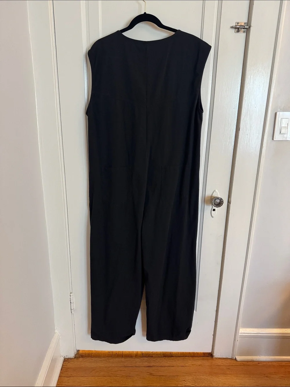 Sleeveless Black Jumpsuit with Front Buttons and utility pockets - Picture 3 of 12